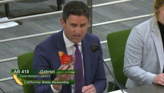 Pictured above: Assemblymember Gabriel showcases Skittles purchased in the European Union which contain no trace of Titanium Dioxide–the toxic additive currently found in Skittles in the United States.